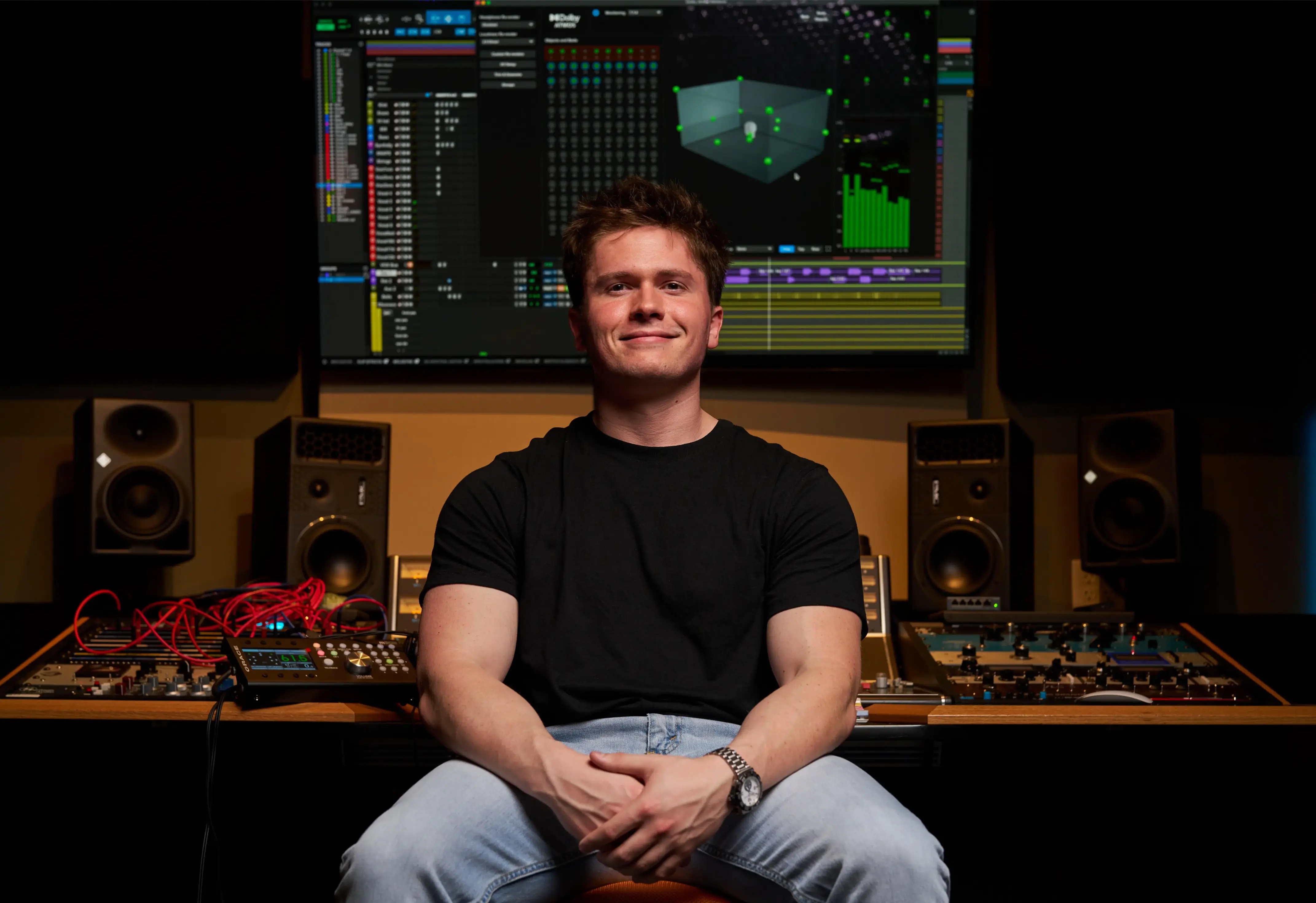 Jason Kushy seated at mixing desk